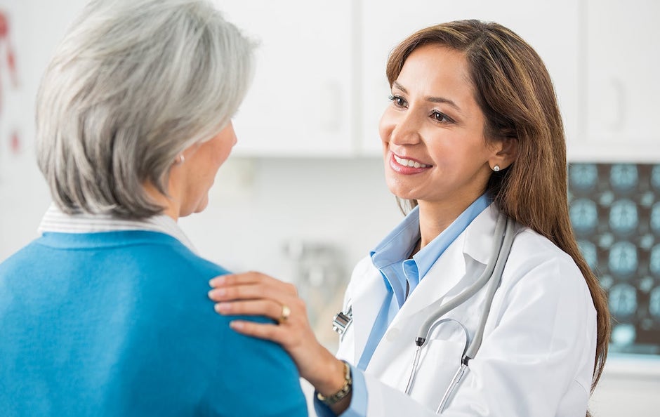 woman doctor greets patient